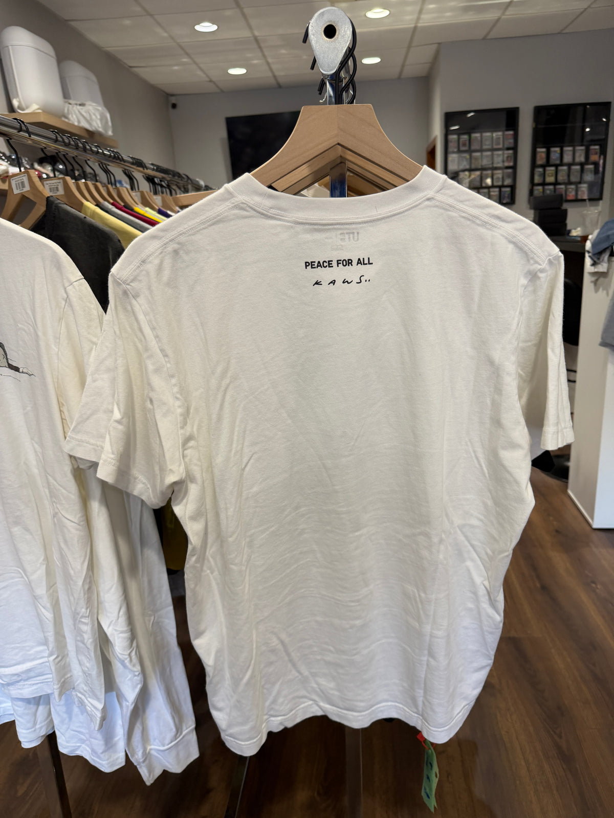 Kaws x Uniqlo Peace for All Tee